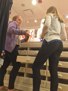 Booty in Black Tights - Girl Bending Over at the Store