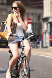 Candid Girl in Short Skirt Flashing Her Panties While Riding a Bike Street Creepshot