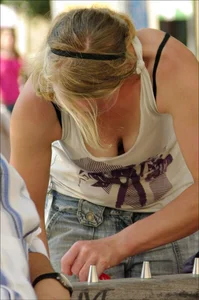 Blonde babe with nice tits showing some cleavage
