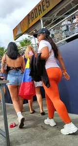 Latina MILF in orange leggings plus booty shorts