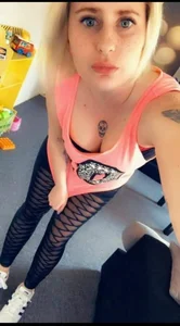 A Tattooed Candid Girl i n Sport Tights Home Selfie