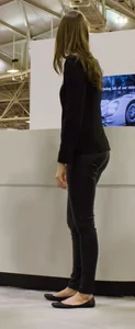 Pretty car saleswoman in tight shiny black pants with nice ass