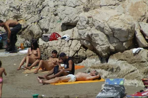Girls on a nude beach in Sitges, Spain
