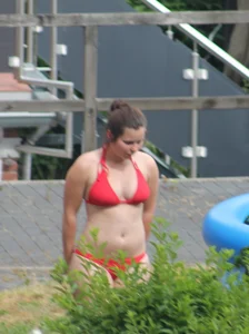 Thick babe in the backyard in red bikini