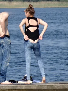 Girl on the water in black thong bikini with a nice ass