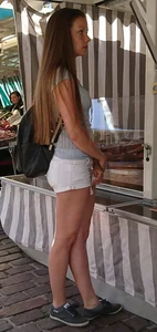 Pretty blonde babe with nice legs in white denim shorts