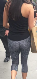 Sexy girl walking in grey patterned leggings with friend in tight jeans