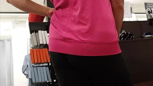 Nice ass in leggings standing in line shopping