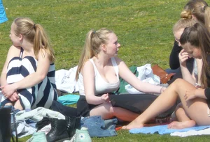 Teen taking off her dress in the park