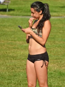 Fit brunette posing in the park. With hoops! [011]