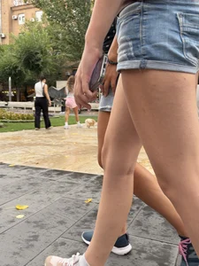 Candid teen wearing denim shorts passing by, nice legs