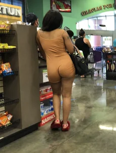 Latina with hard nipples and a big booty in tight spandex shorts outfit