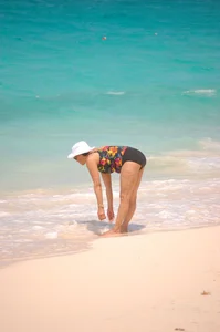 Bunch of sexy girls and milfs in bikinis at the beach