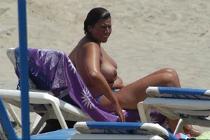 Girls on a nude beach in Sitges, Spain