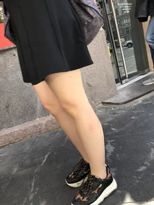 Very nice legs of a candid girl wearing a skirt