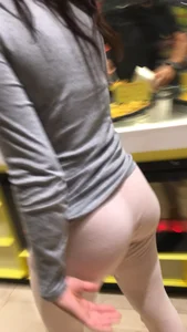 Sexy brunette in pink leggings getting food with a great ass and beautiful face