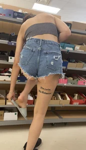 Slim Latina ass peeking out of shorts
