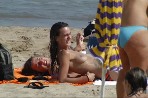 Girls on a nude beach in Sitges, Spain