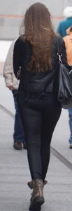 Pretty girl walking in tight black pants
