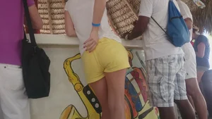 Milf in yellow shorts with vpl and a wedgie