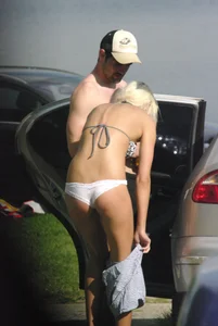Blonde babe changing into and out of bikini and shows her tits
