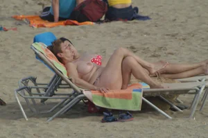 Topless girls on a beach in Barcelona