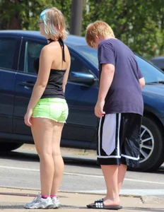 Blonde girl in glasses with a thick booty in green shorts