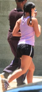 Hot brunette running in short shorts with vpl