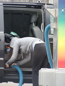 Girls cleaning their cars in jeans and pants