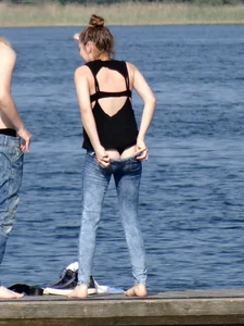 Girl on the water in black thong bikini with a nice ass