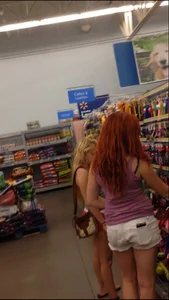 Two Walmart sexy babes in shorts with nice asses