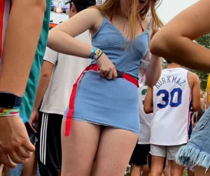 Candid concert hottie giving a peek of her panties in a little skirt and has a sexy jiggly ass 🔥