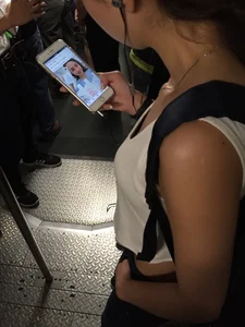 Sexy Asian showing bra under shirt and a little cleavage
