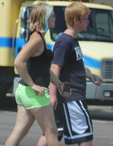 Blonde girl in glasses with a thick booty in green shorts