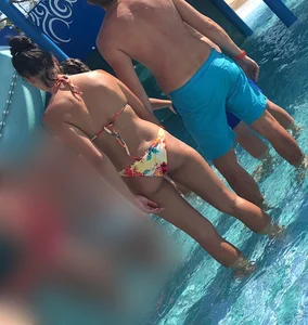 Skinny and sexy tanned bikini girl out at the pool