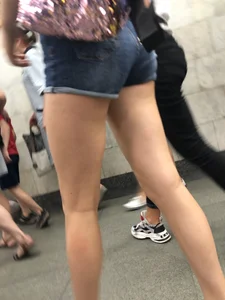 Tall Candid Teen Girl in Denim Shorts And Sandals Sitting in the Subway Train, Then Walking Down the Station