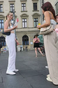 Long blonde braless in a white outfit (many pictures)