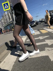 Skinny candid teen wearing shorts and black pantyhose crossing the street