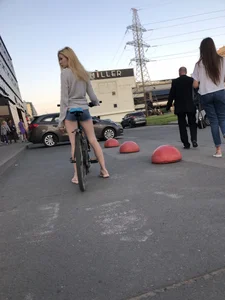 Hot Blonde in Mini Shorts on the Bike City Candid