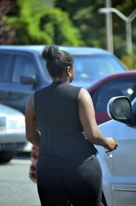 Chubby black lady with big tits and no bra lets it slip