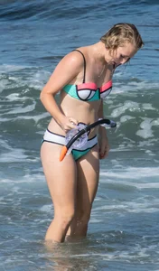 Sexy beach blonde snorkeling in bikini
