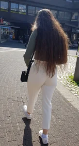 Sexy candid chick with long hair wearing white pants street creepshots