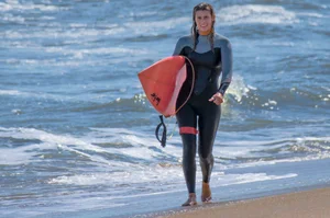 Candid girls surfing on the beach