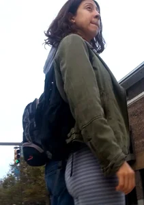 College girl in striped leggings walking with nice ass
