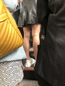 Awesome Candid Girl in a Leather Skirt And Sneakers Walking Down a Street, Then Flashing Her White Panties on the Stairs Creepshots Gallery