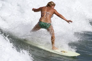 Candid surfer babes on the beach and in bikinis