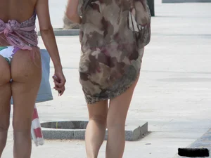 Bunch of sexy babes at the beach in thong bikinis