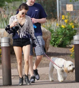 Cutie walking her dog in short denim shorts and showing a bit of cheek