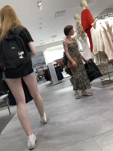 Hot Girl with Pale Skin in a Store Wearing Blue Denim Shorts Creepshots
