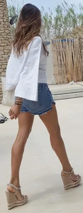 Flat ass leggy girl in denim shorts